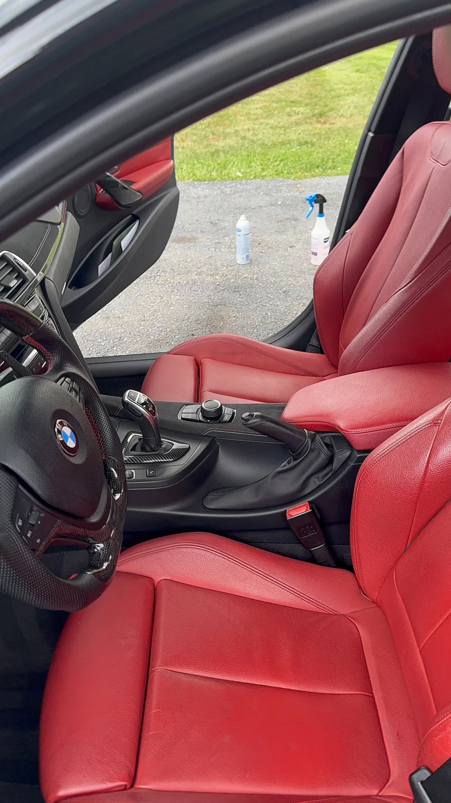 Detailed BMW cabin with red leather and a clean center console